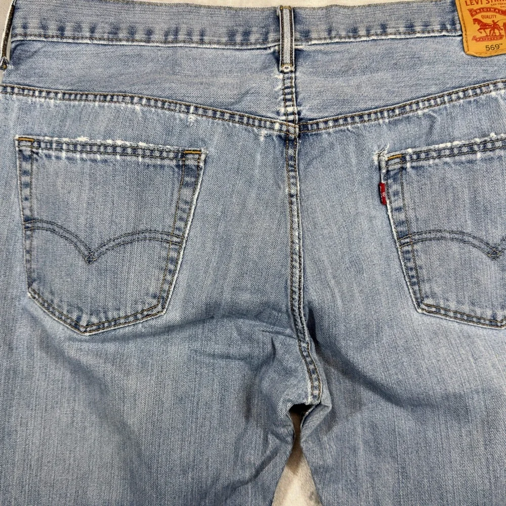 Levi's 569 Loose Straight Jeans 36x34 Light Wash Heavily Distressed‎ Faded